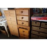 A pair of bedside chests fitted three drawers