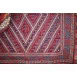 An approx. 3'10" x 3'8" Gazak rug