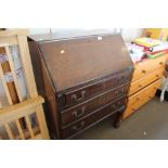A mahogany bureau fitted three drawers raised on c