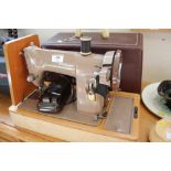 A Singer sewing machine (sold as collector's item)