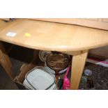 A hardwood extending dining table with two chairs