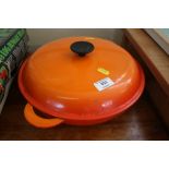 A Le Creuset pot and cover