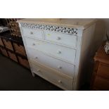 A white painted chest fitted two short over three