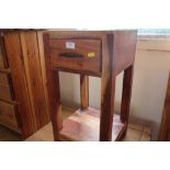 A hardwood bedside table fitted single drawer