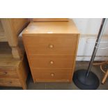 A three drawer bedside chest