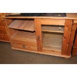 A pine TV stand fitted single drawer