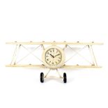 A novelty clock, in the form of a vintage bi-plane