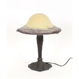 A Tiffany design bronzed effect table lamp, with o