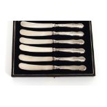 A cased set of six silver handled butter knives