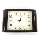 An Art Deco design black cased wall clock