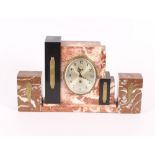 An Art Deco three piece marble clock set