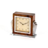 An Art Deco design walnut and chrome mantel clock