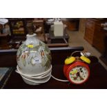 A pottery table lamp base and a Micky Mouse alarm