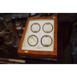 A maple effect table top watch display cabinet