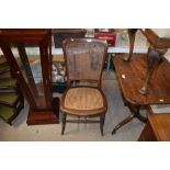 A mahogany and cane seated chair