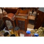 An early 20th Century oak smokers cabinet with bra