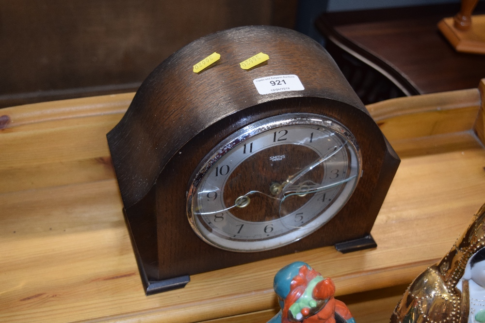 A Smiths oak cased two hole mantle clock