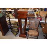 A mahogany and glazed display jardinière stand wit