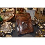 An Edwardian mahogany coal scuttle and shovel