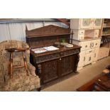 A Victorian oak sideboard fitted two frieze drawer