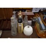 Three soda syphons; various glass decanters; a pla