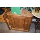 A pine corner cupboard