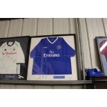 An autographed Chelsea football shirt signed by th