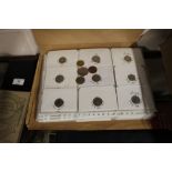 Two folders of various foreign coins