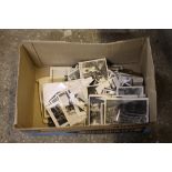 A box of black and white photos