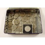 A tin of various coins