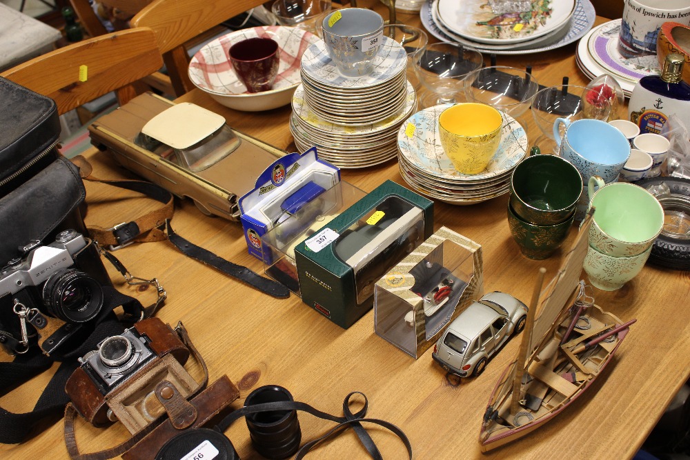 A quantity of various model cars and a small boat