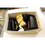 A box containing Franklin Mint knives, lighters, a