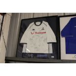 An autographed Tottenham Hotspur shirt signed by t