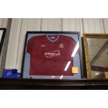 An autographed West Ham United football shirt sign