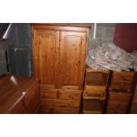 A pine two door wardrobe fitted two short over two