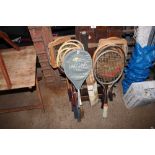 A quantity of badminton rackets etc.