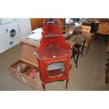 A mahogany corner cabinet