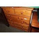 A modern pine chest fitted two short over four lon