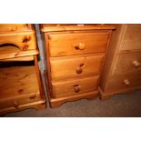 A pine three drawer bedside chest
