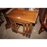 A nest of three hardwood tables