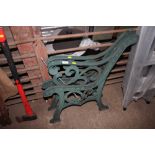 A pair of metal garden bench ends