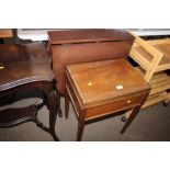 A sewing box together with drop leaf table