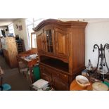 A hardwood dresser raised on covered base fitted t