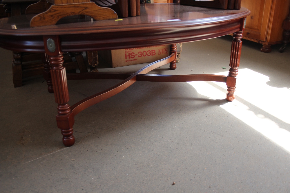 A reproduction mahogany coffee table