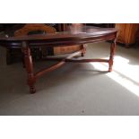 A reproduction mahogany coffee table