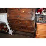 An oak bureau fitted two drawers