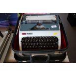 An Erika portable typewriter in carrying case