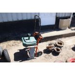 A sack barrow; a garden kneeler and a parasol stan