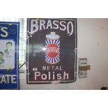 A reproduction Brasso metal sign