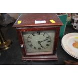 A wooden case single hole mantel clock